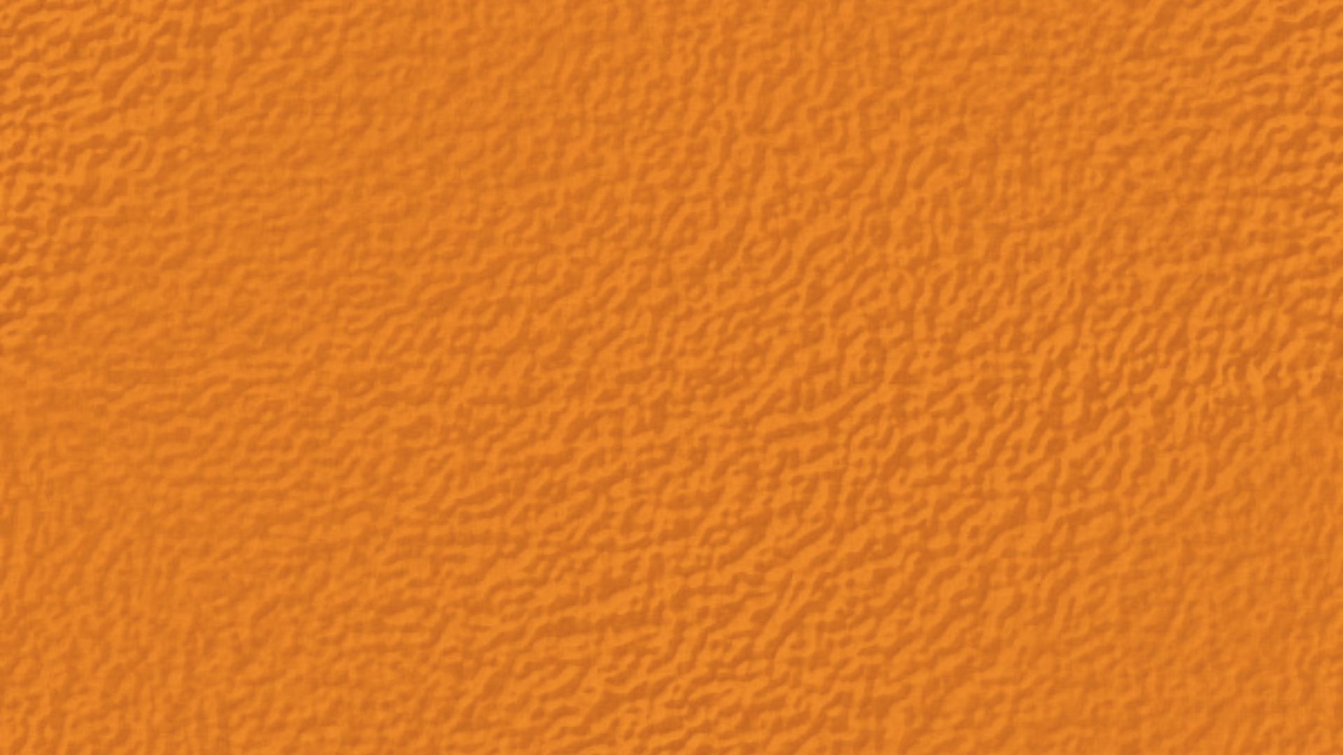 Bright orange background with consistent orange peel texture, showing dense dimpled bumps.