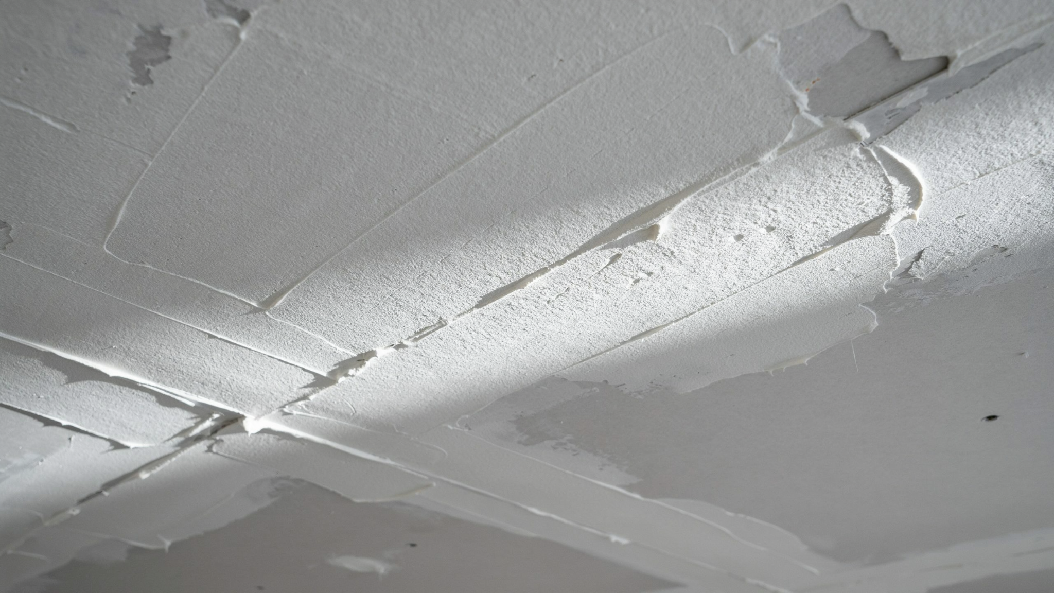 ceiling with sheetrock texture displaying rough layered finish creating bold artistic and visually striking surface.