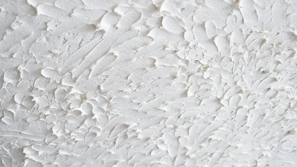 ceiling with stipple brush texture showing deep peaks and valleys creating bold dramatic surface texture.