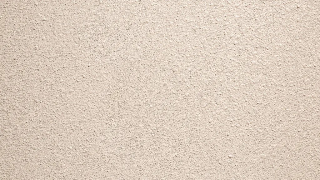 close up of orange peel wall texture showing fine evenly distributed bumps creating subtle surface pattern under soft indoor lighting.