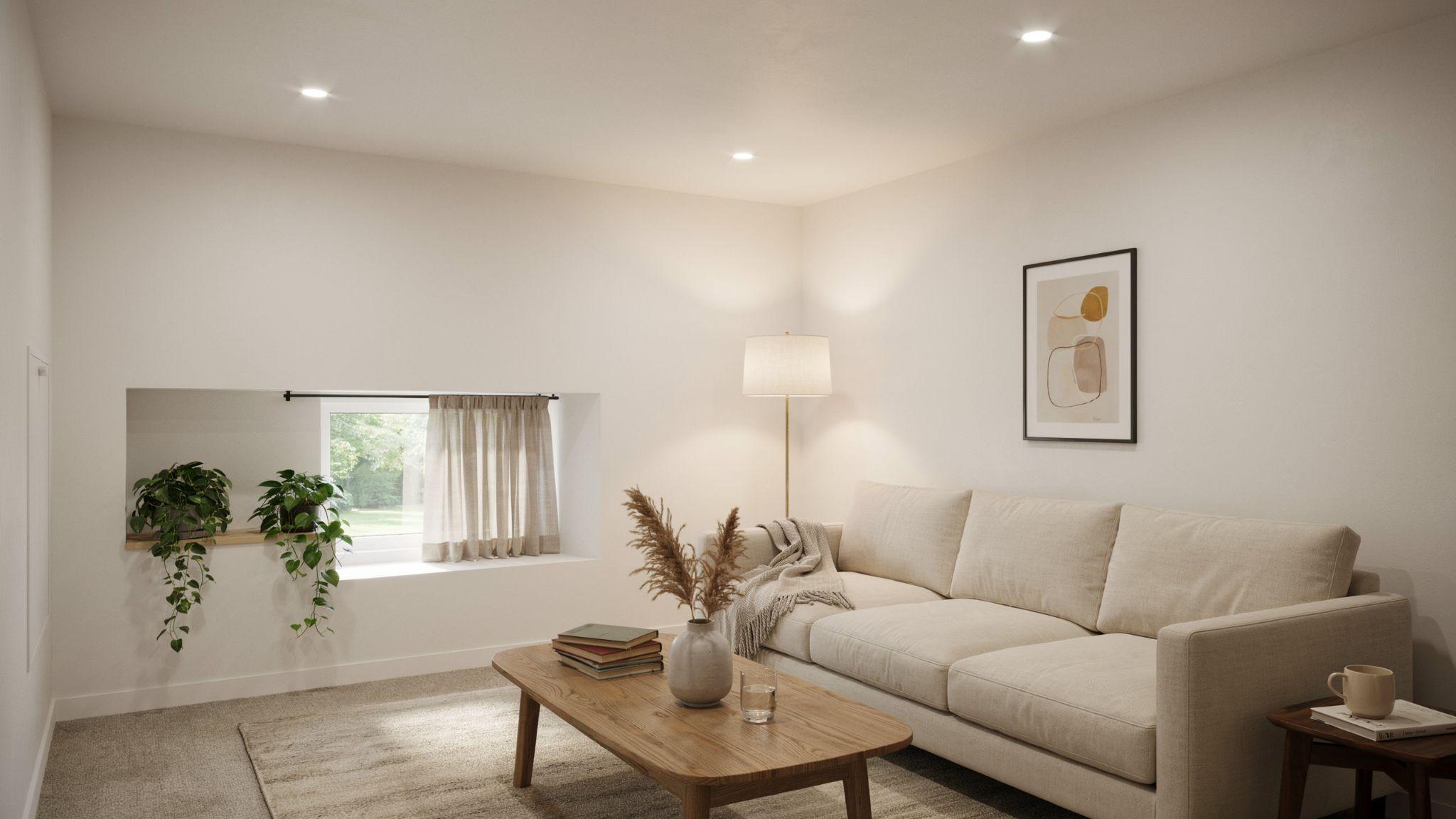 Warm cozy modern basement interior painted in creamy off-white influenced by Behr Swiss Coffee with soft lighting and classy neutral furnishings.