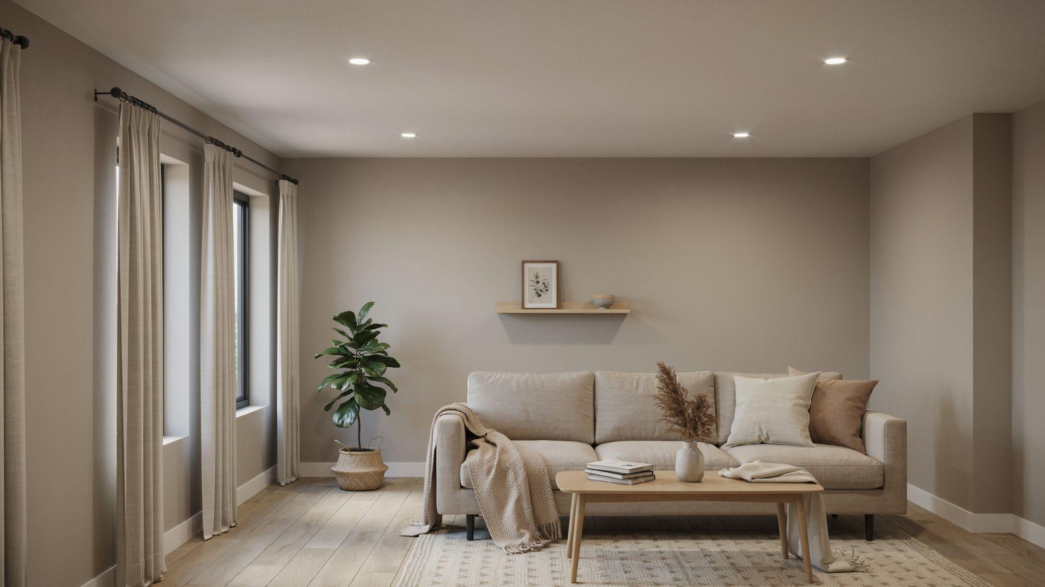 Modern cozy basement interior painted in balanced greige influenced by Sherwin-Williams Agreeable Gray with soft lighting and neutral contemporary decor.