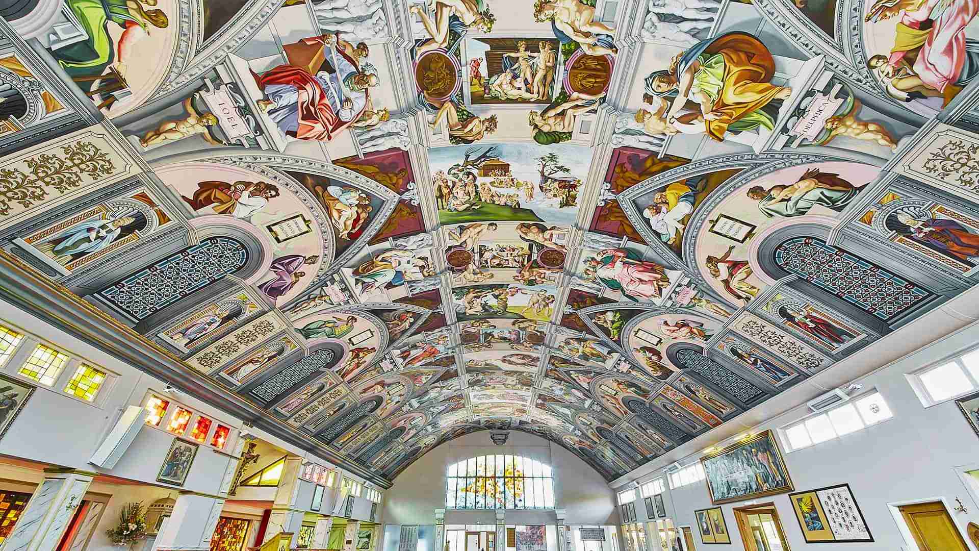 Michelangelo’s painted ceiling in the Sistine Chapel shows biblical scenes in vibrant color.